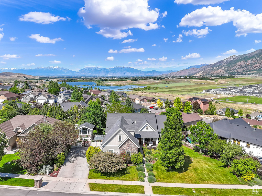 Aerial view of residential area featuring a water and mountain view