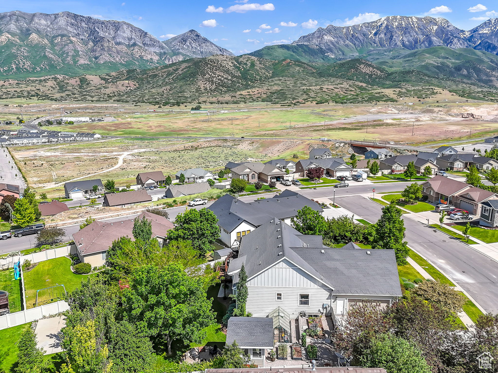 Aerial view of residential area featuring a mountain backdrop