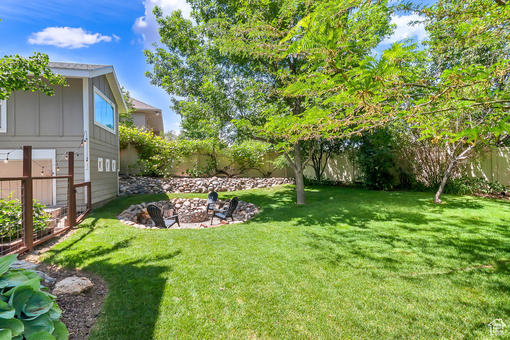 View of yard featuring a fire pit