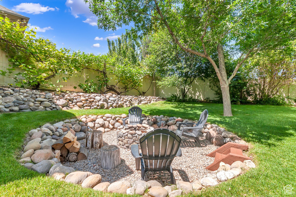 View of yard with an outdoor fire pit