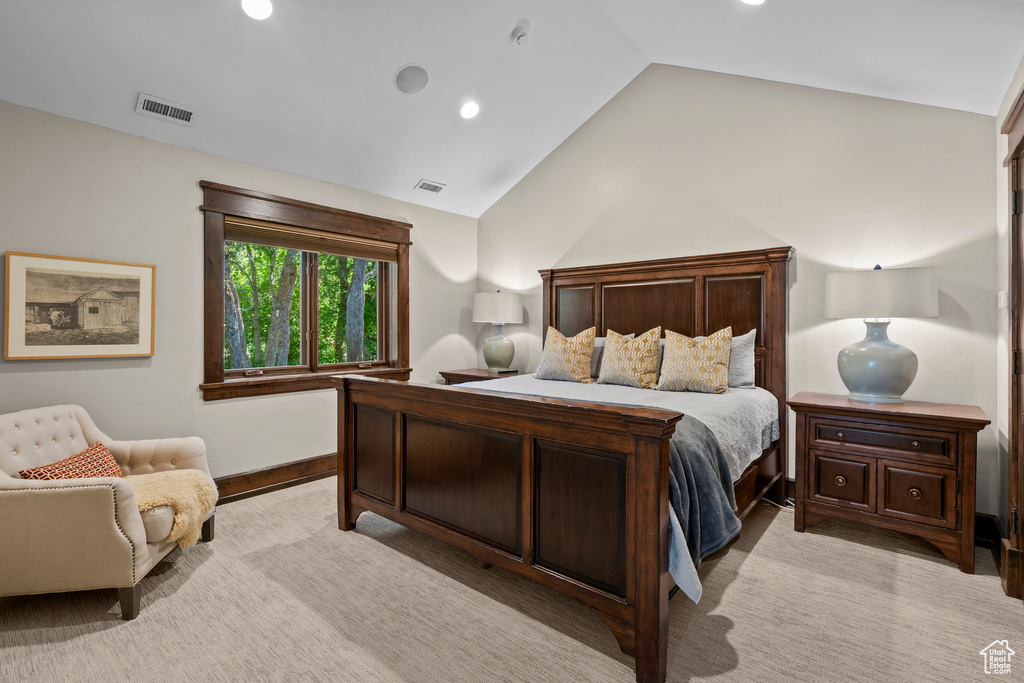 Bedroom with vaulted ceiling, recessed lighting, and baseboards
