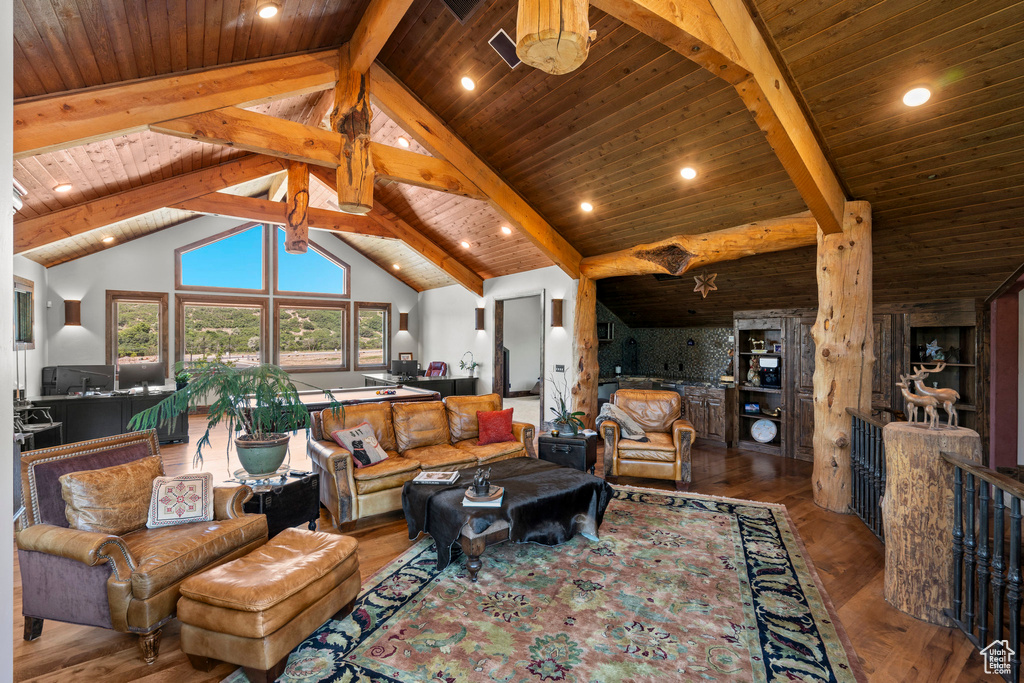 Living area with wooden ceiling and wood finished floors