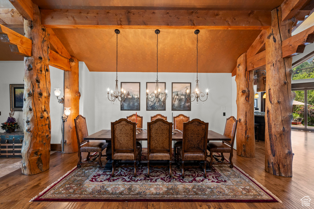 Dining room with a chandelier and wood finished floors
