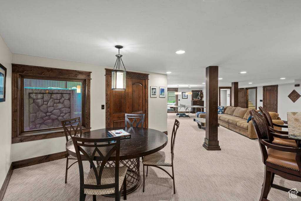 Dining space with light colored carpet, recessed lighting, and baseboards