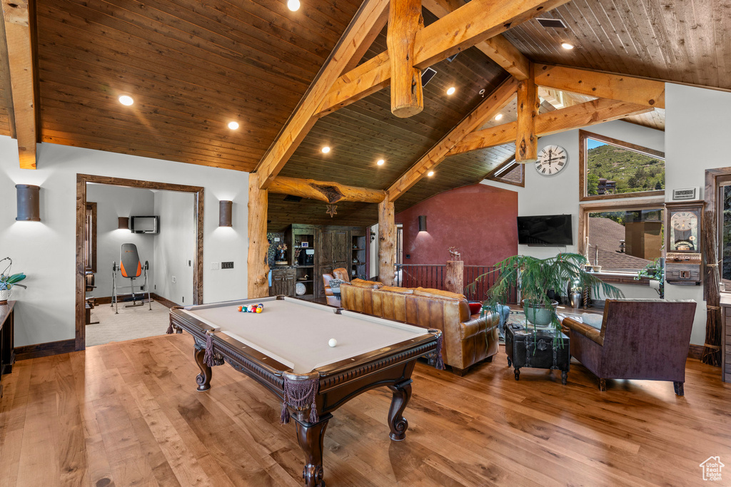 Recreation room featuring billiards table, high vaulted ceiling, wooden ceiling with exposed beams, wood finished floors, and baseboards