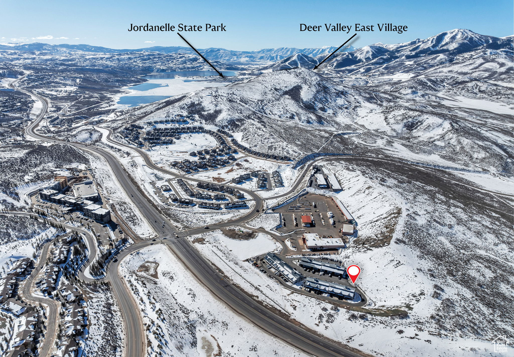Snowy aerial view with a mountain view
