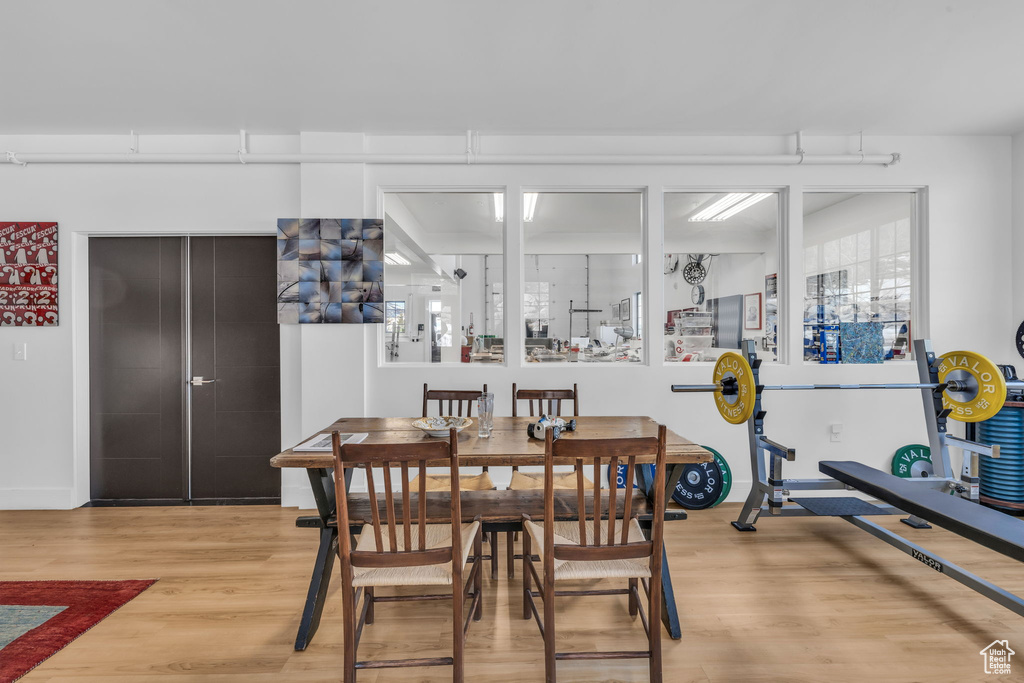 Dining space featuring wood finished floors and baseboards