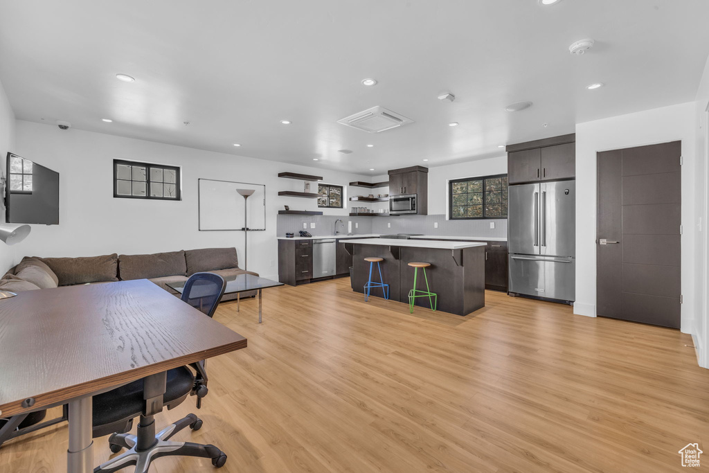 Living room featuring recessed lighting and light wood-type flooring