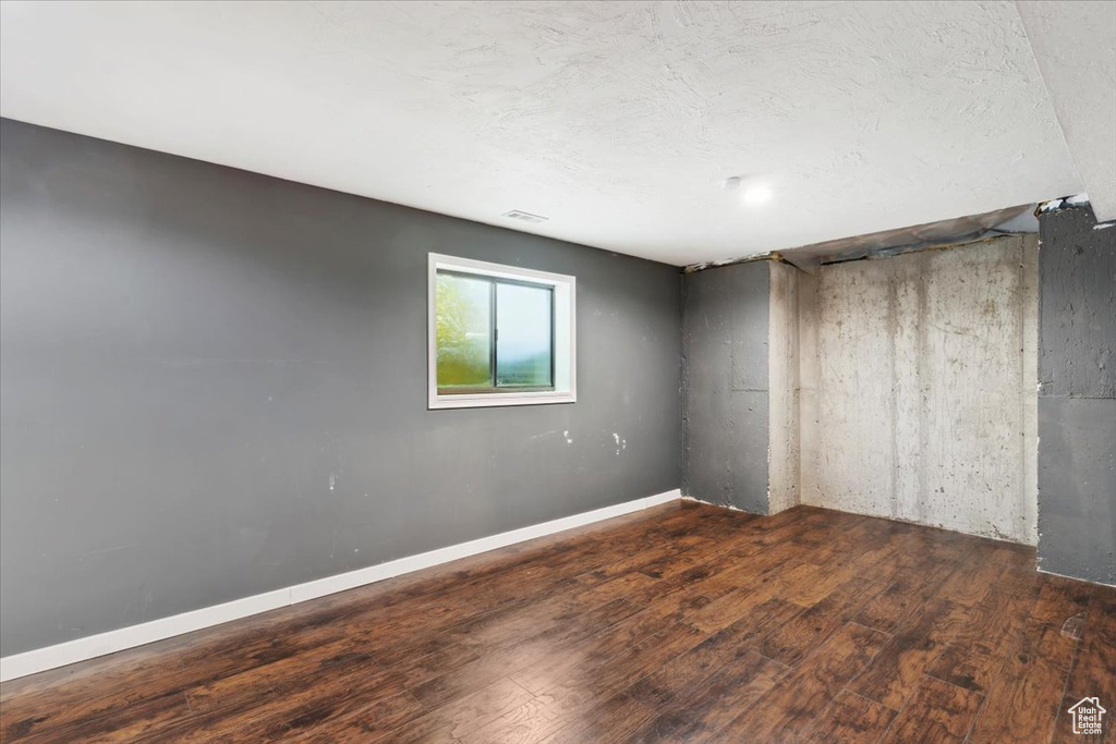 Unfurnished bedroom featuring wood finished floors