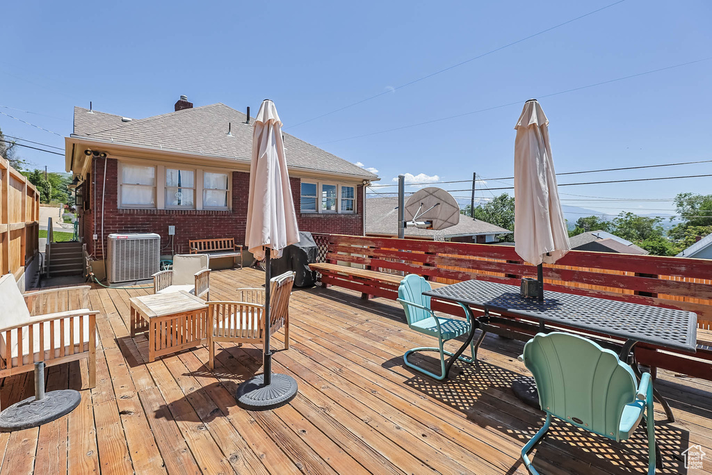 Deck with central AC and outdoor dining area