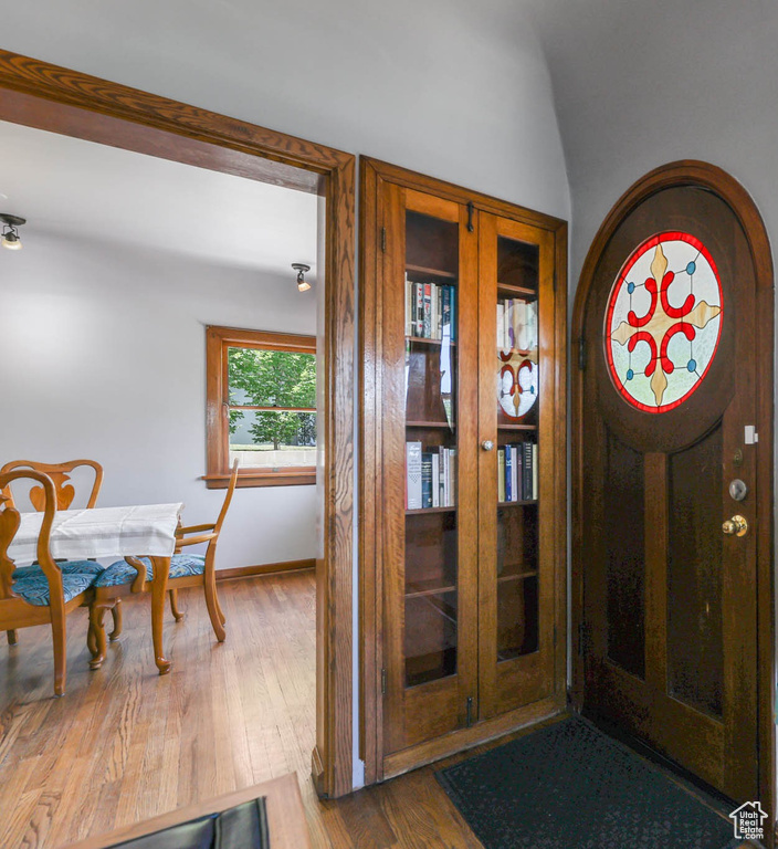 Entrance foyer featuring wood finished floors and baseboards