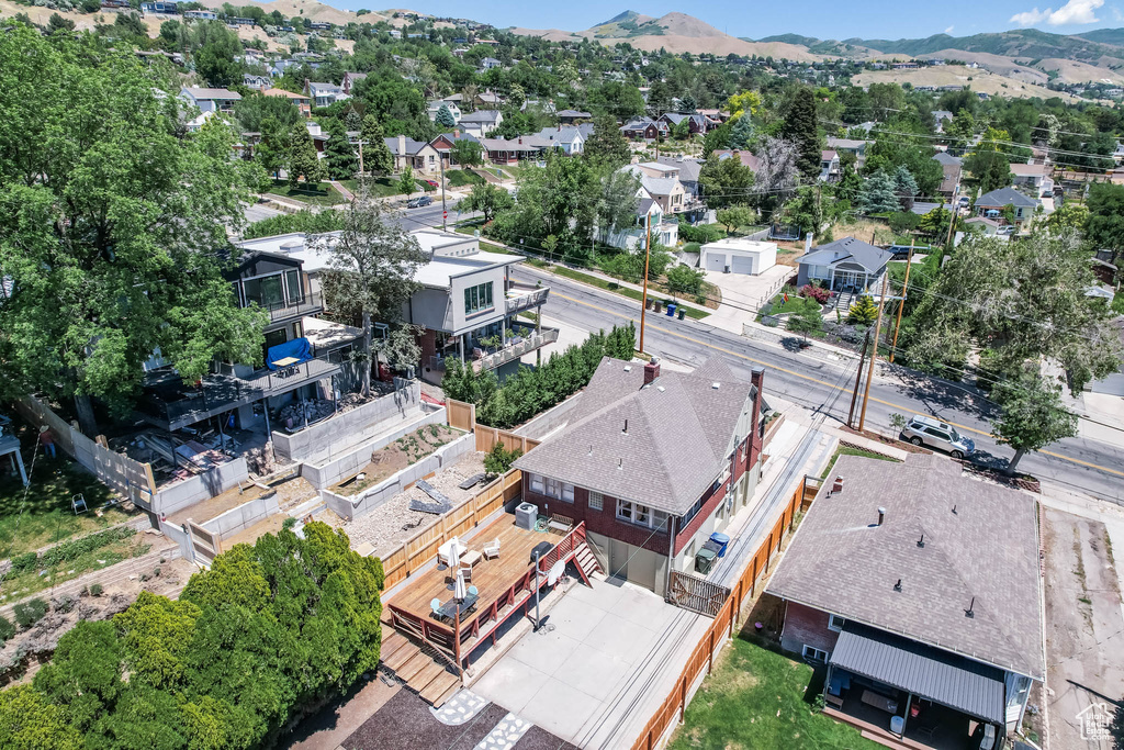 Aerial view of residential area featuring a mountain backdrop