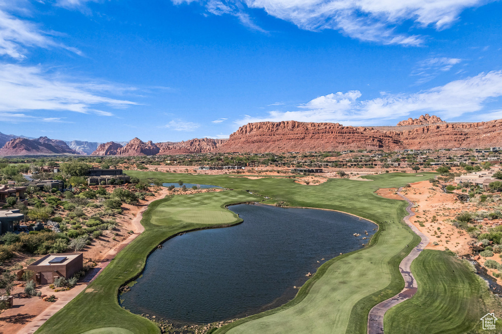 View of home's community featuring a water and mountain view and view of golf course