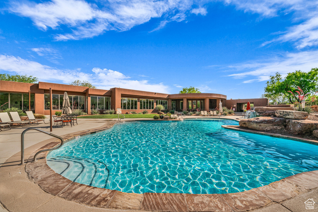 Community pool with a patio area