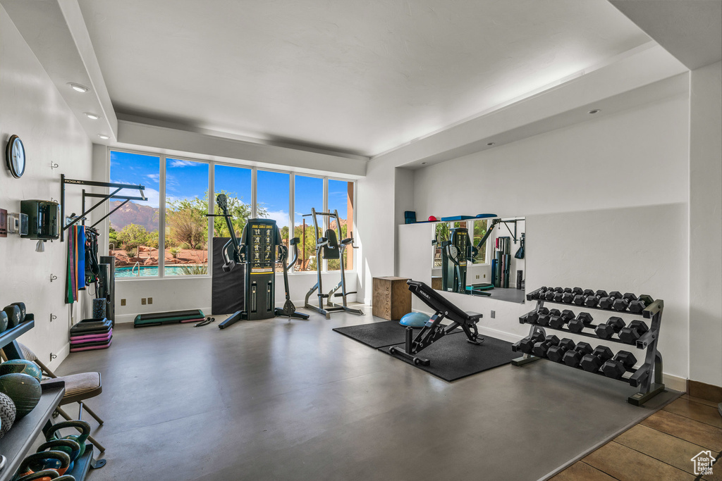 Workout area featuring baseboards and recessed lighting