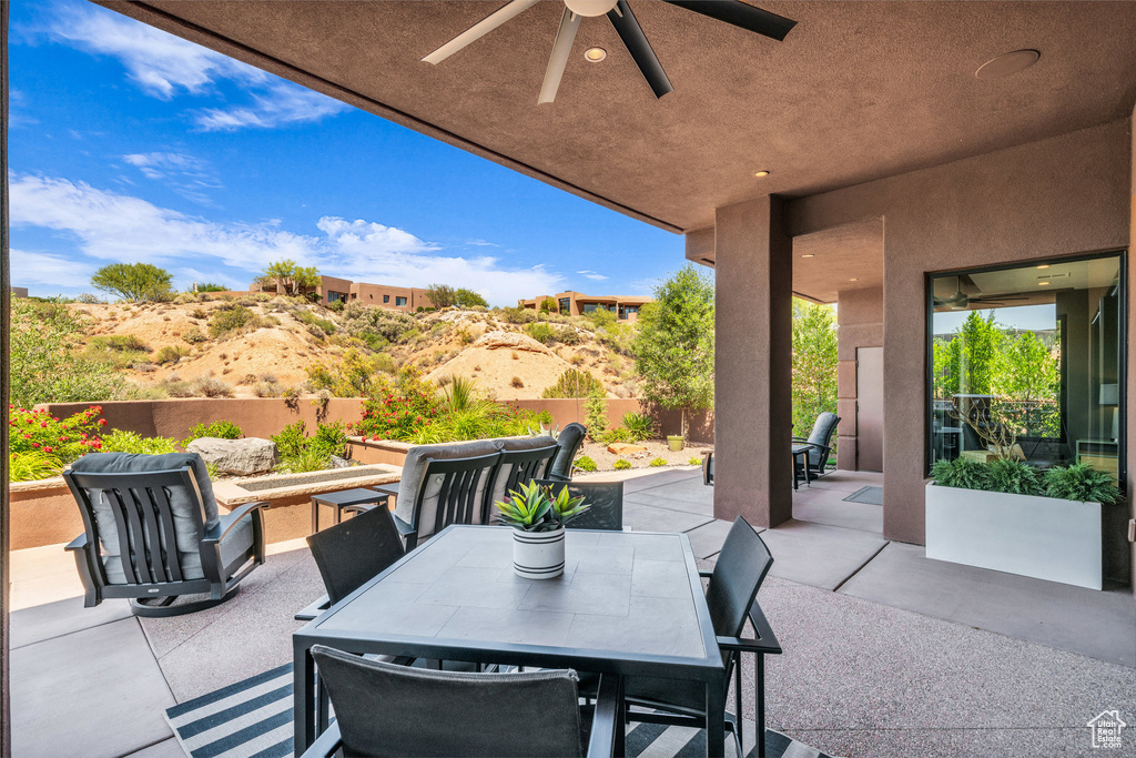 View of patio / terrace with a ceiling fan and outdoor dining space