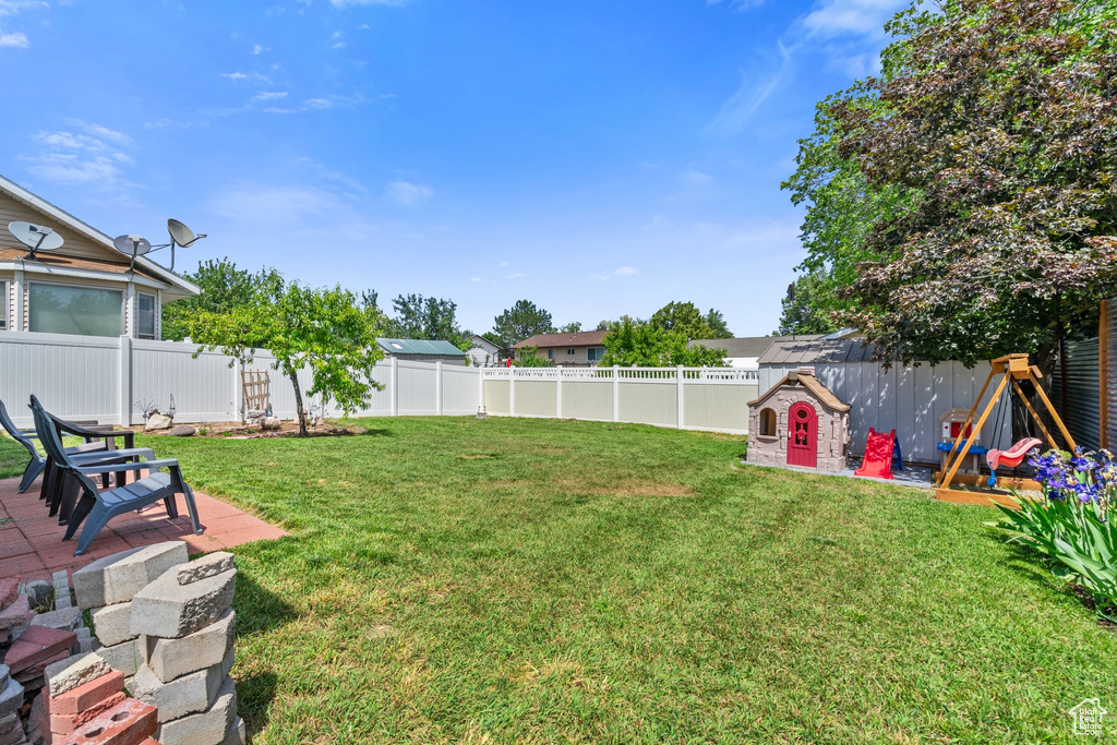 View of yard with a patio