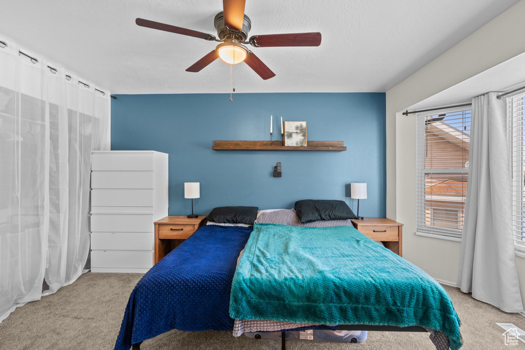 Bedroom with carpet and a ceiling fan