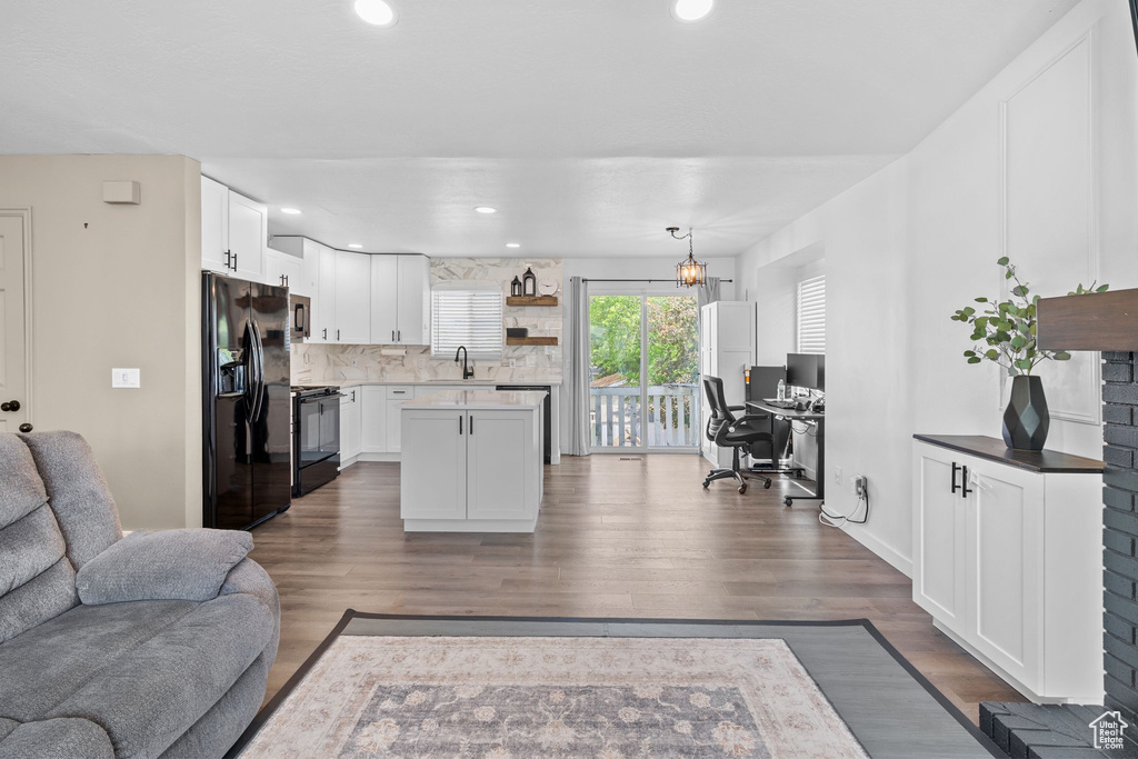 Living area featuring an office area, dark wood finished floors, and recessed lighting