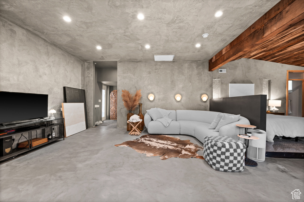 Living room featuring finished concrete floors