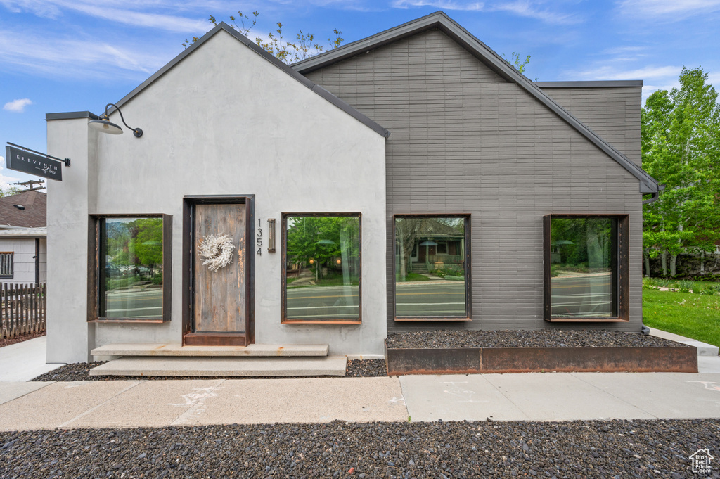 View of front of house featuring stucco siding
