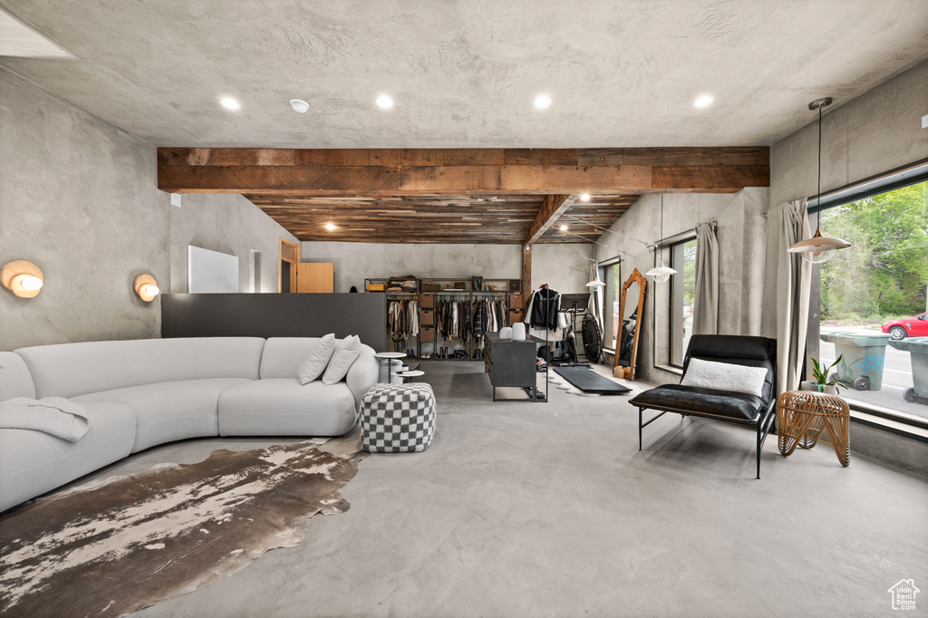 Living room featuring finished concrete floors