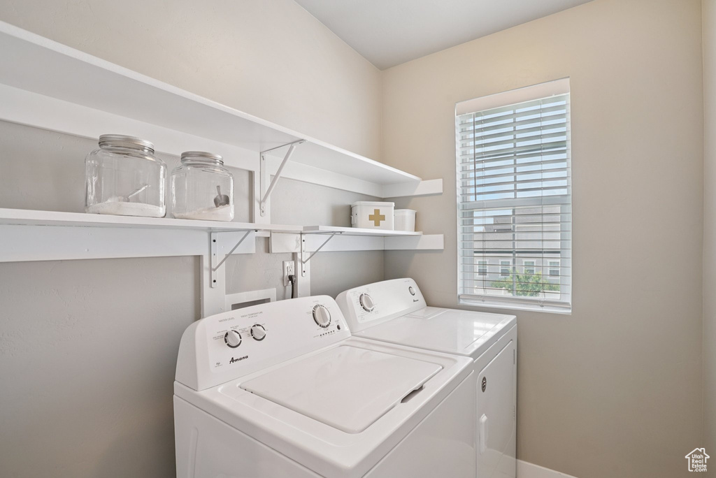 Laundry area featuring washer and clothes dryer and plenty of natural light