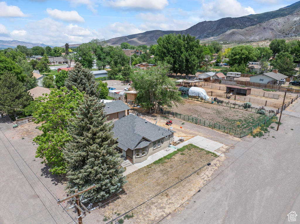 Aerial perspective of suburban area with a mountain backdrop