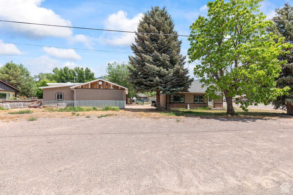 View of front of property featuring stucco siding