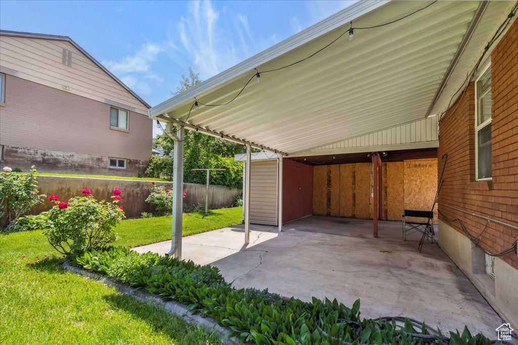 View of patio / terrace with a carport