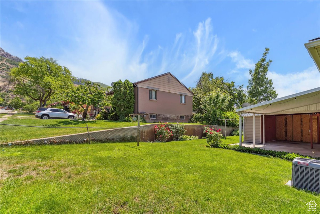 View of yard with central AC