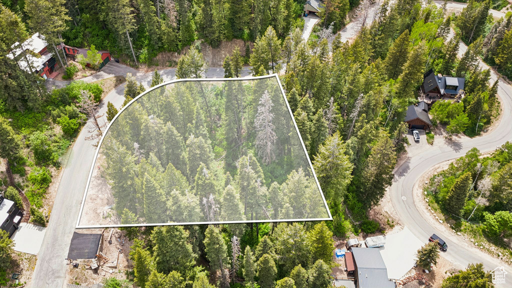 Aerial view of property and surrounding area featuring property boundaries highlighted