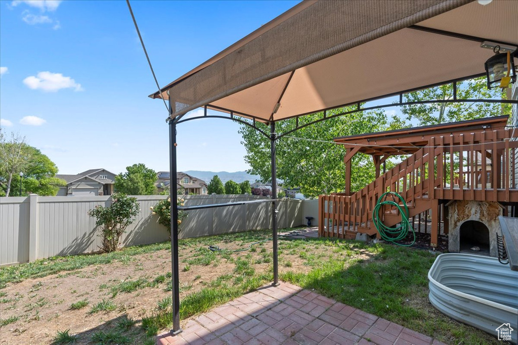 Fenced backyard with a patio area
