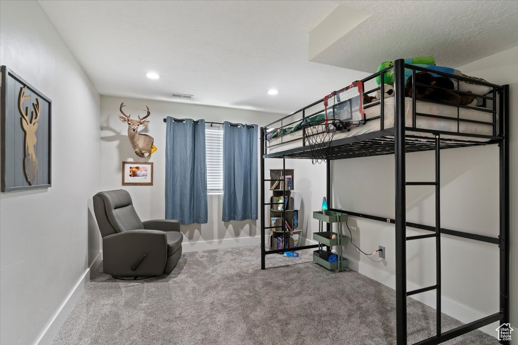 Carpeted bedroom featuring baseboards and recessed lighting