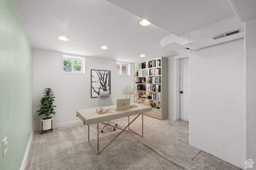 Carpeted home office with recessed lighting and baseboards
