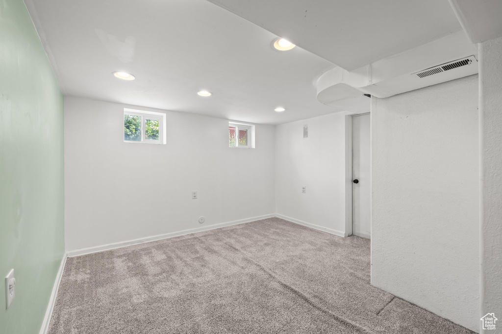 Below grade area featuring recessed lighting, carpet flooring, and baseboards