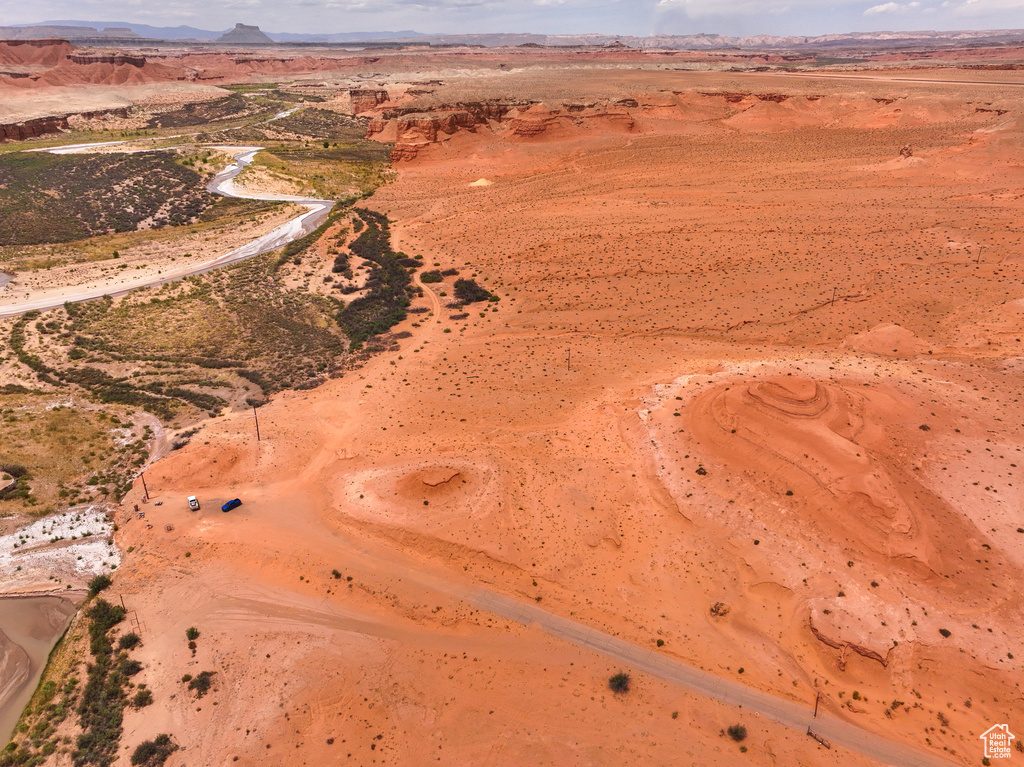 Aerial view of property and surrounding area with mountains, a desert landscape, and rural landscape