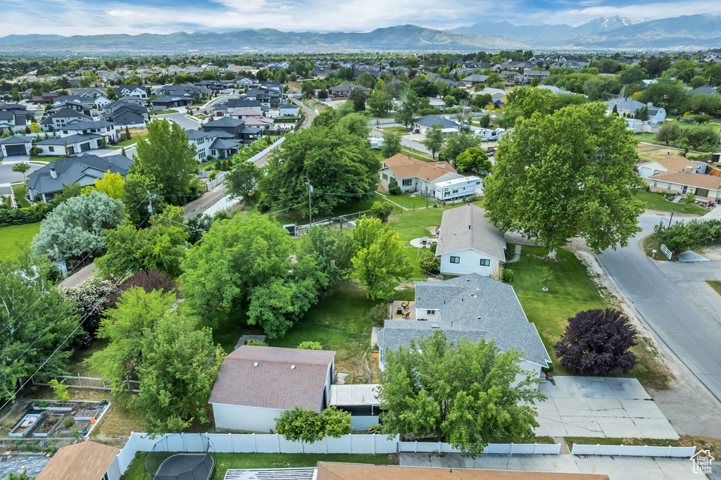 Aerial perspective of suburban area featuring a mountainous background