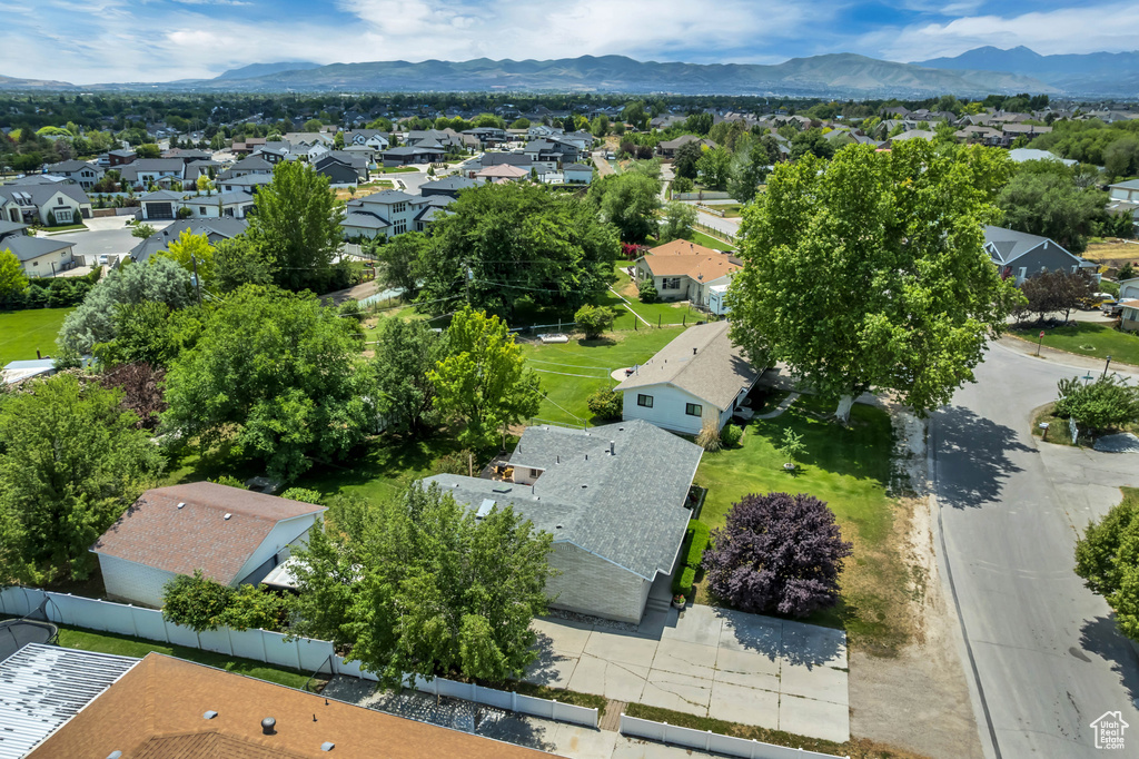 Aerial view of residential area featuring a mountainous background