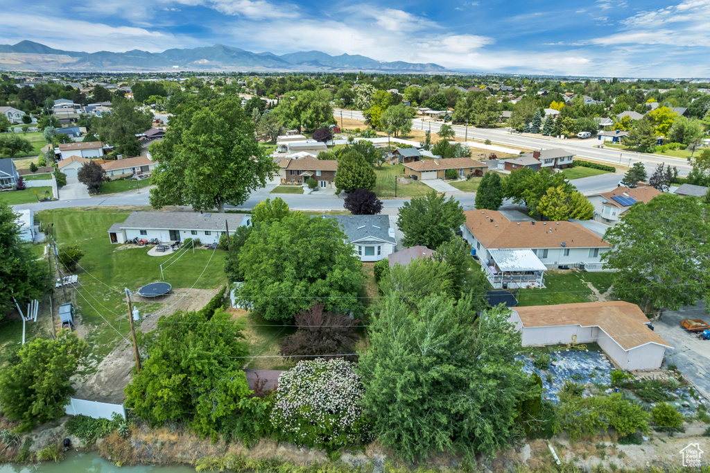 Aerial perspective of suburban area featuring a mountainous background