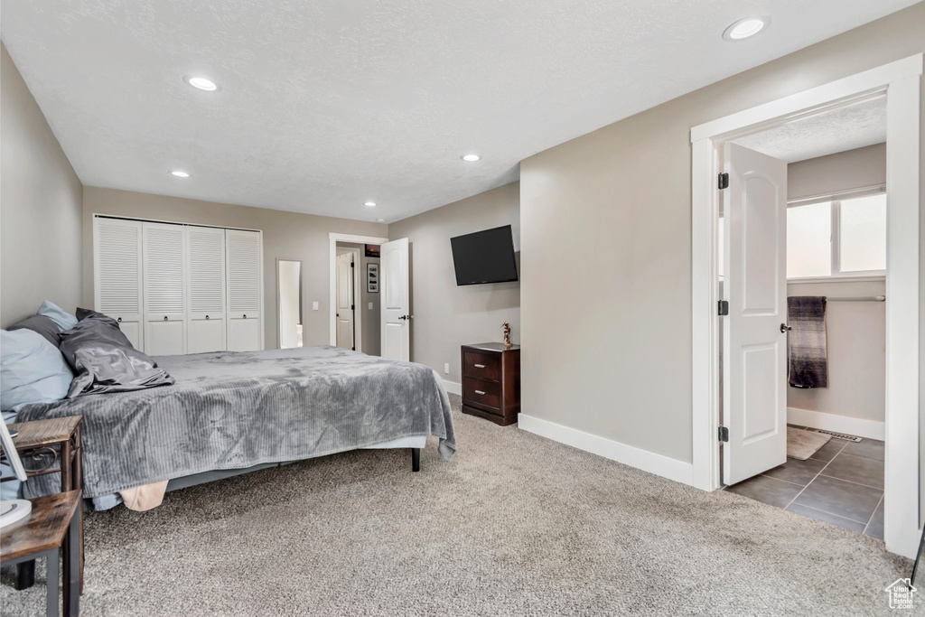 Carpeted bedroom featuring recessed lighting, a closet, and baseboards