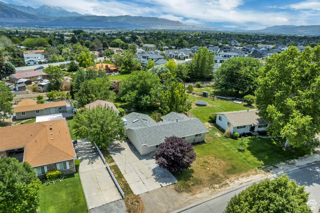 Aerial perspective of suburban area featuring a mountainous background