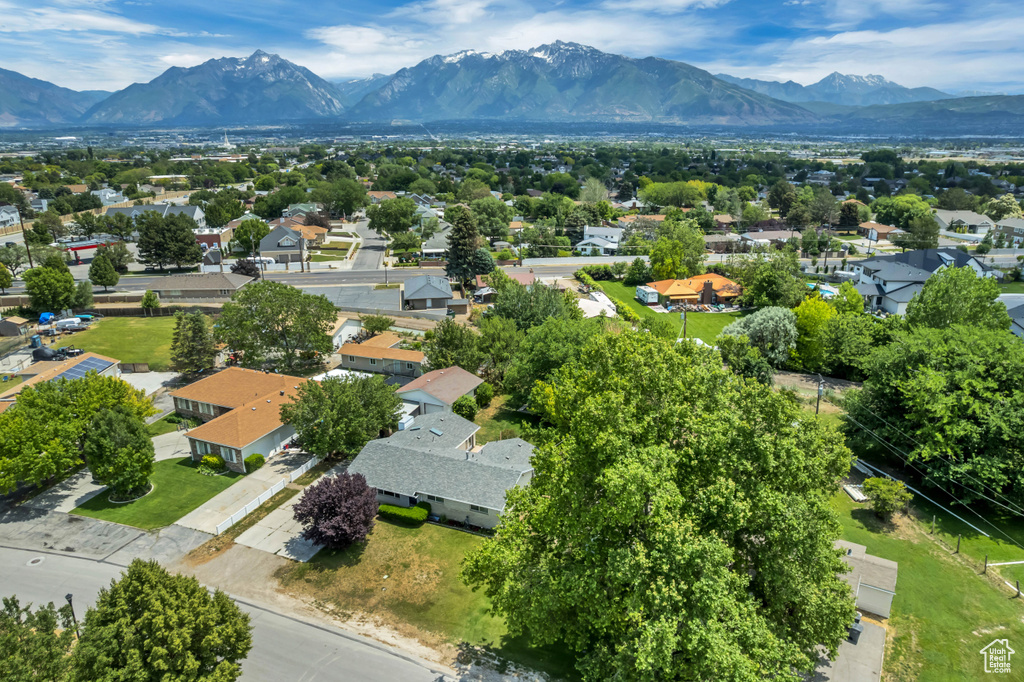 Aerial perspective of suburban area with a mountain backdrop