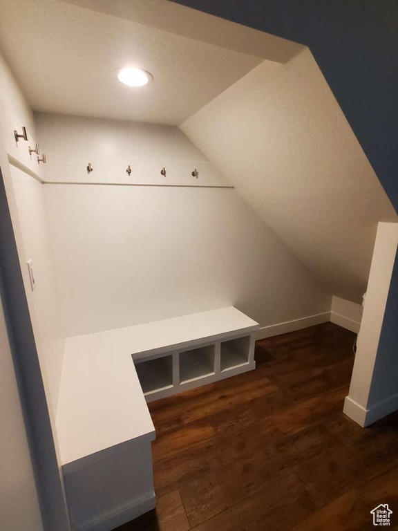 Mudroom featuring lofted ceiling, wood finished floors, baseboards, and recessed lighting