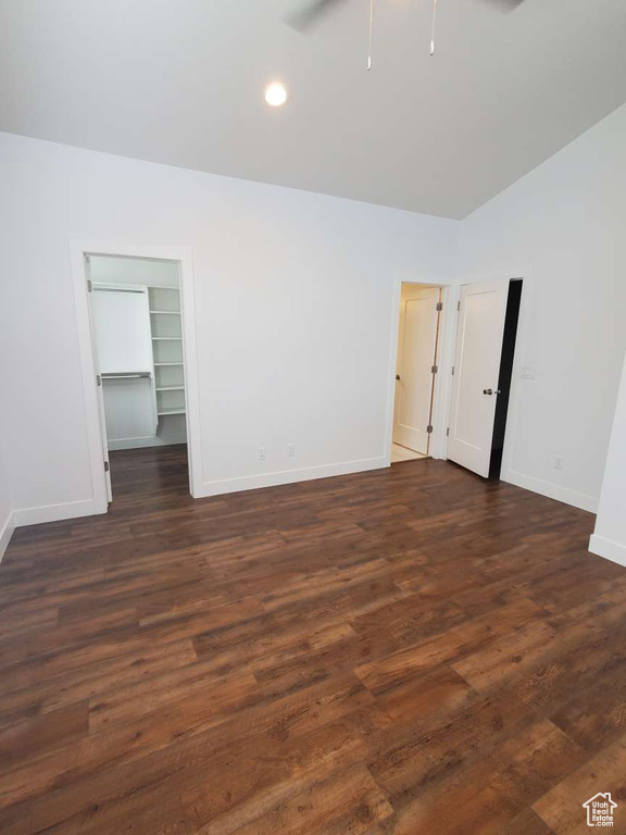 Unfurnished room with baseboards, a ceiling fan, dark wood-type flooring, and recessed lighting