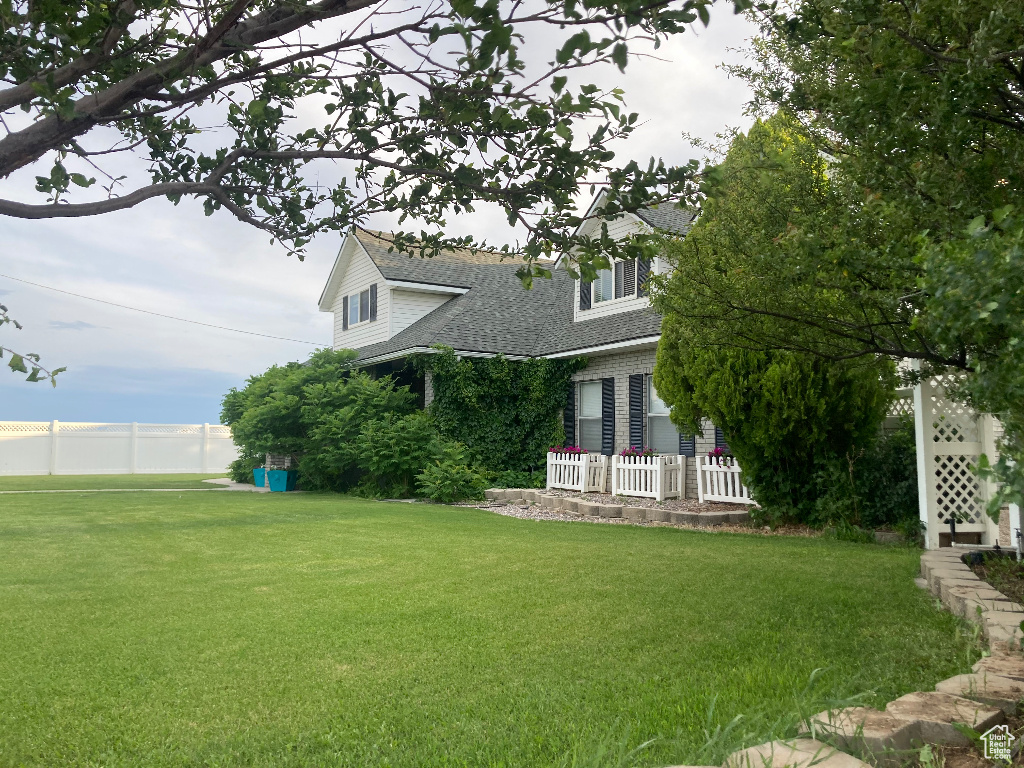 View of home's exterior with a shingled roof