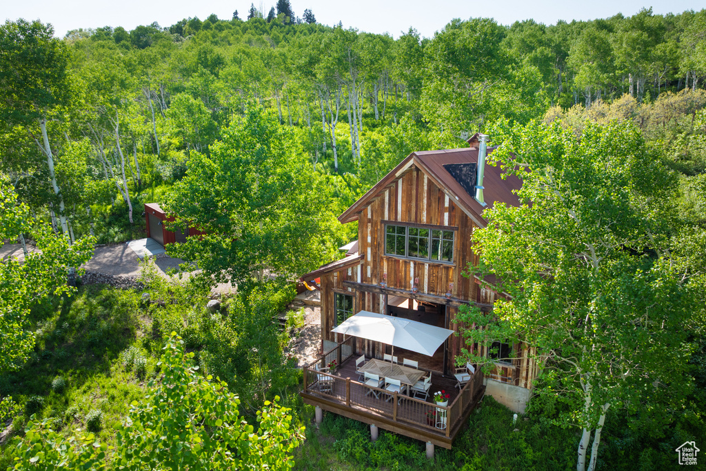 View of subject property featuring a forest