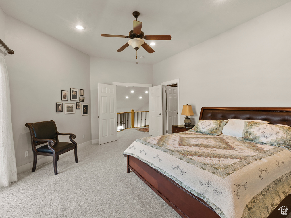 Bedroom with light carpet, baseboards, recessed lighting, and a ceiling fan