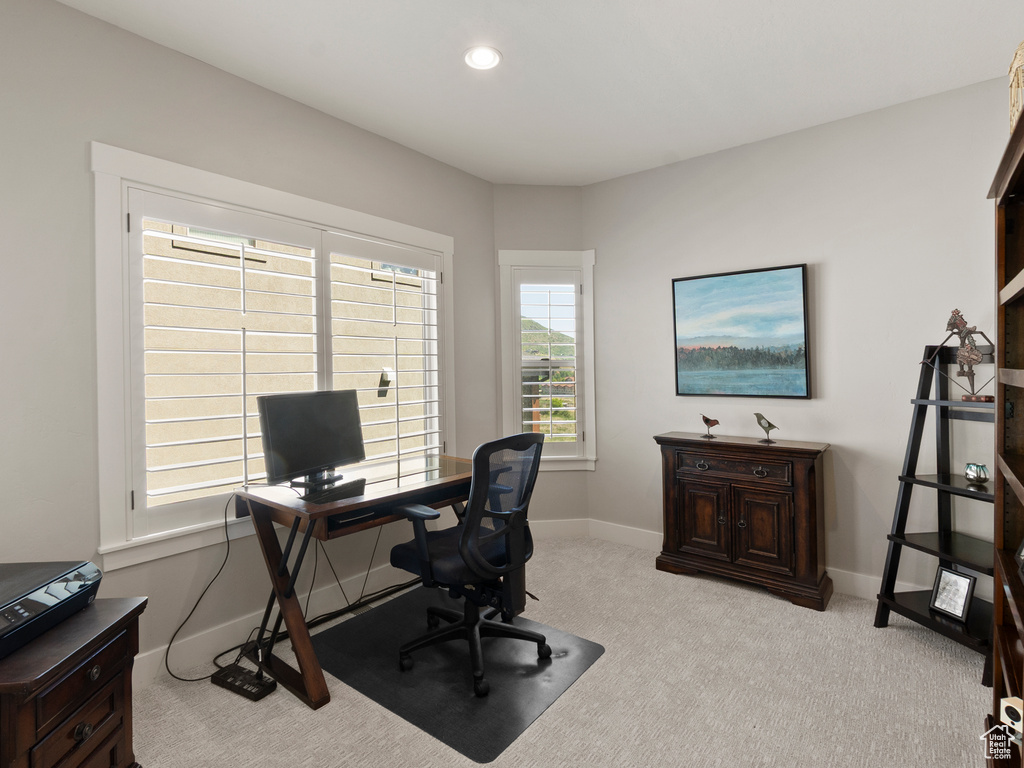Office space with light carpet, baseboards, and recessed lighting