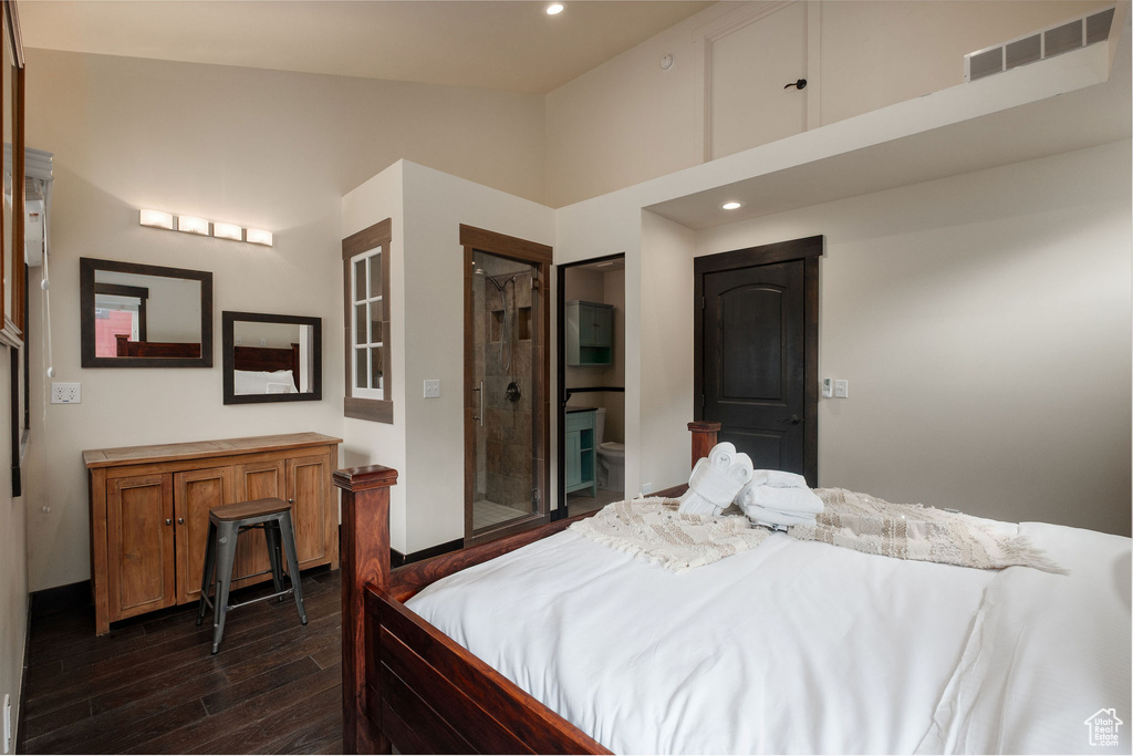 Bedroom with dark wood-style floors, recessed lighting, and a high ceiling